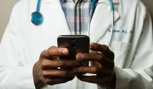 A doctor using a phone